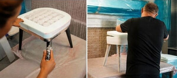 Craftsperson assembling a modern wooden chair in a furniture workshop