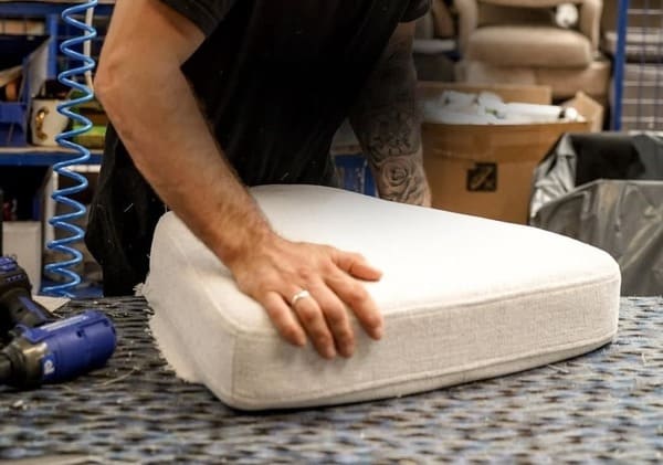 artisan upholsterer working in English workshop